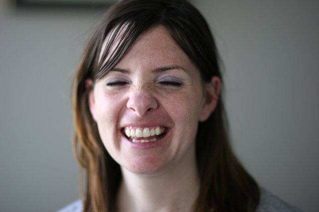 Joyful Woman Laughing with Eyes Closed