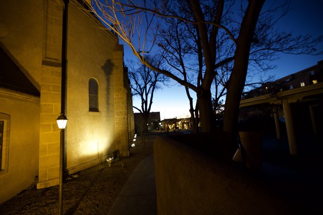 Church at Twilight with Bare Trees and Street Lamp