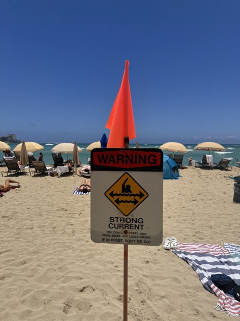 Heed the Warning: A Sunny, Yet Cautious Day at Waikiki Beach