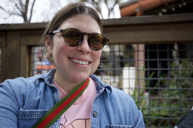 Smiling Portrait at Outdoor Venue in Sunglasses