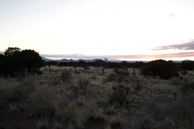 Twilight Over Desert Grassland and Distant Mountains