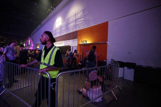 Security Guard Monitors Crowd at Wobbleland Festival