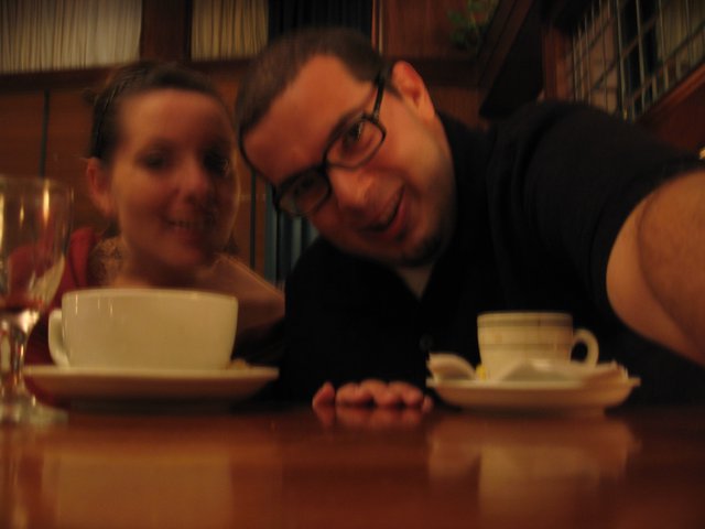 Couple Sharing Coffee at a Cozy Restaurant Table