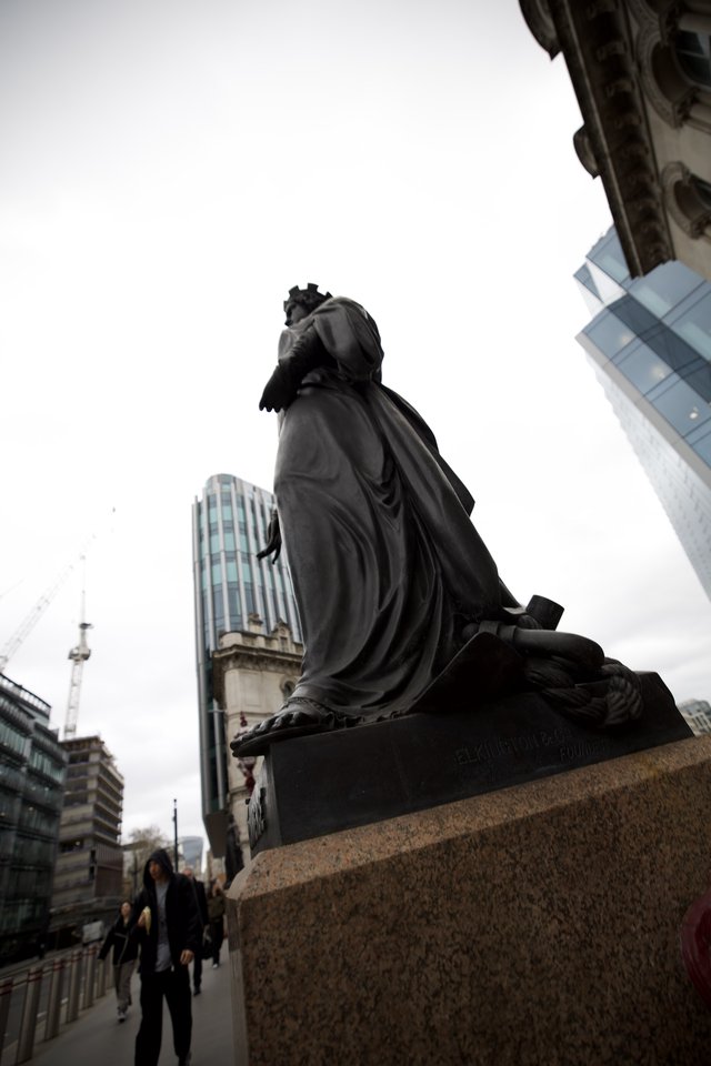 Royal Statue Against Modern London Skyline