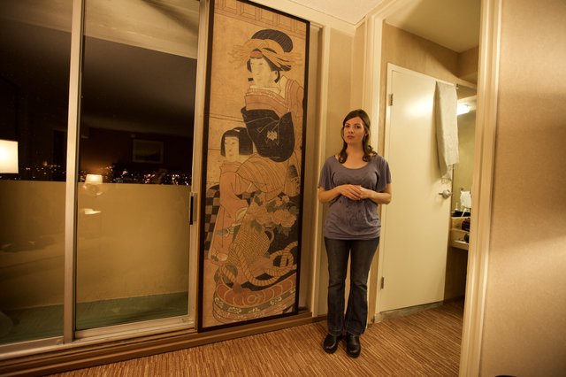 Woman Beside Giant Japanese Art Hotel Room