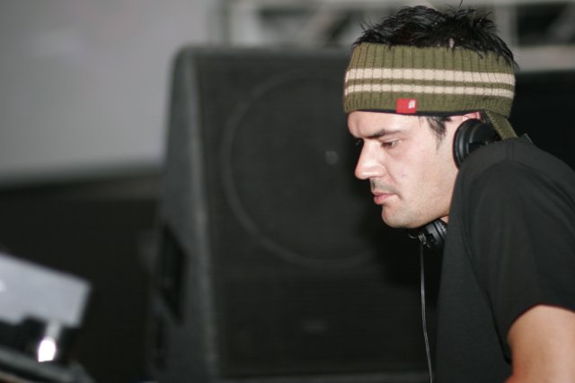 Black Shirted Man with Beanie and Headphones