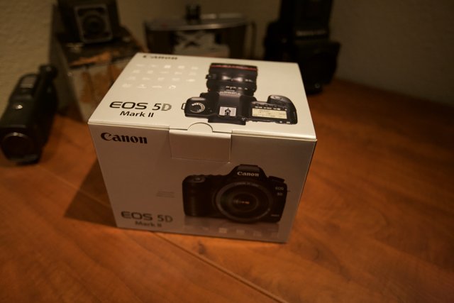Unpacking the Canon EOS 5D Mark II in a Wooden Container
