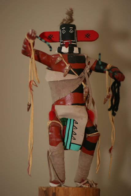 Wooden Pole with Native American Doll