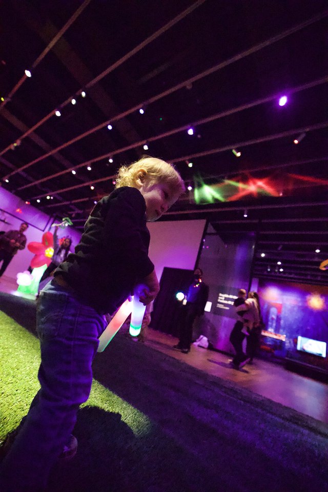 Child at Baby Rave Event with Glow Stick