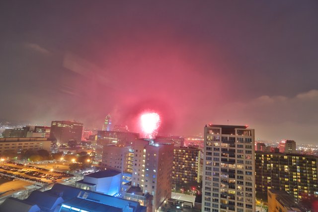 Fireworks illuminate the urban night sky