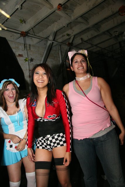Three Women Strike a Pose in Costume