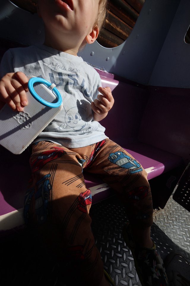 Child Playing with Mirror Toy in Fantasyland