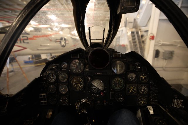 Fighter Jet Cockpit View with Vintage Aircraft Display
