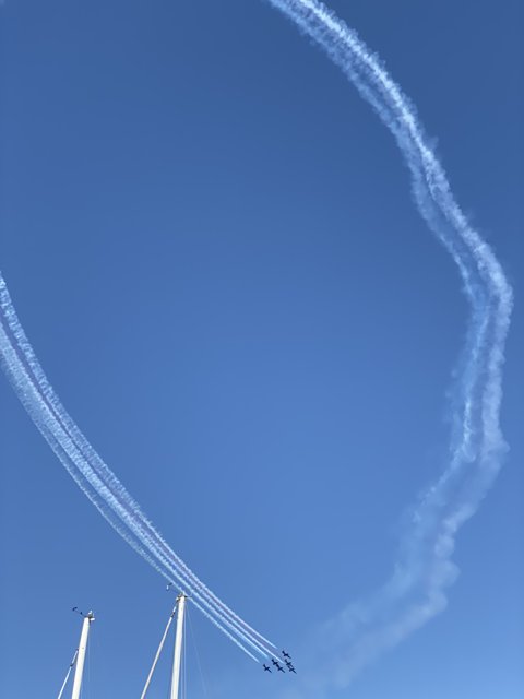 Twin Jets Soar Through Azure Skies