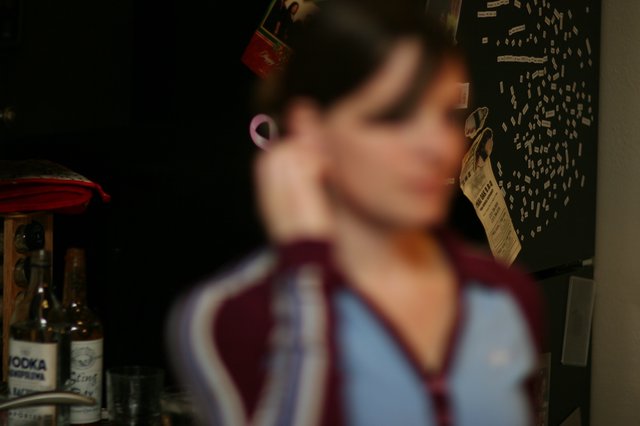 Blurred Portrait of Woman in Kitchen Setting