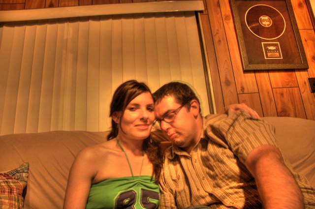 Couple Relaxing Together on Couch in Warm Light