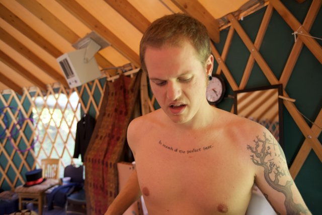Tattooed Man in a Yurt