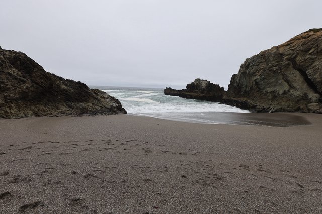 Secluded Cove Between Rocky Cliffs at Dusk