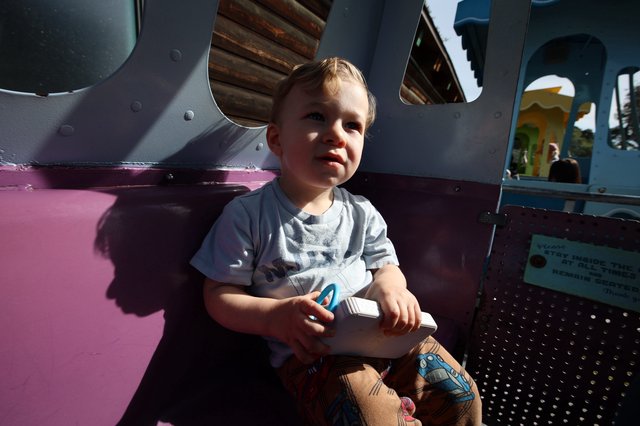 Young Child Enjoying Playground Adventure in Fantasyland