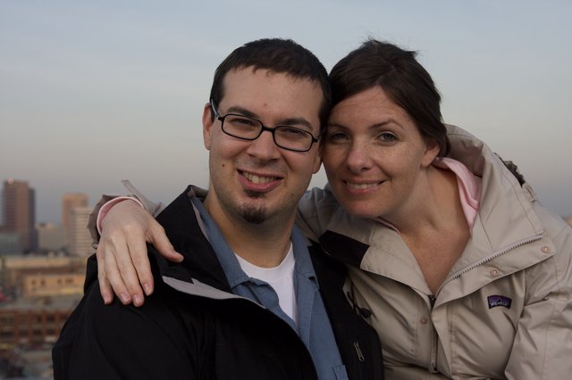 Couple Smiling Together Against City Skyline