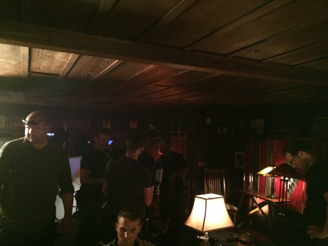 Gathering of Men in a Lighted Pub
