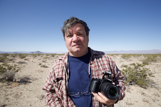 Desert Photographer Stands in Arid Mojave Wilderness