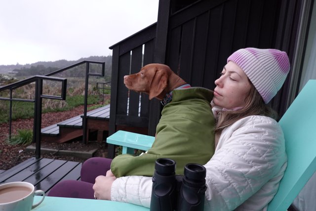 Woman and Dog Enjoying Coffee in the Outdoors