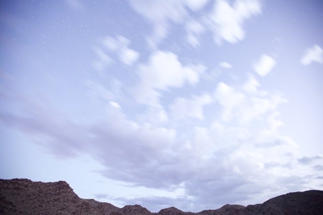 Majestic Mountain Range Under a Dramatic Sky