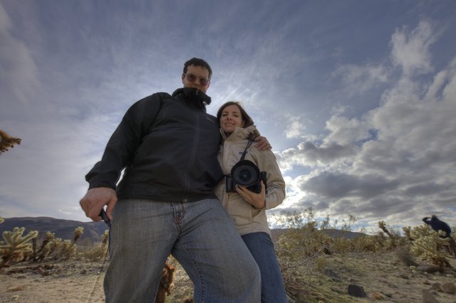 Couple Poses Among Joshua Tree Desert Cacti