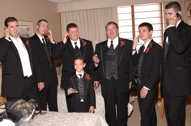 Groomsmen All on Cell Phones Before Wedding