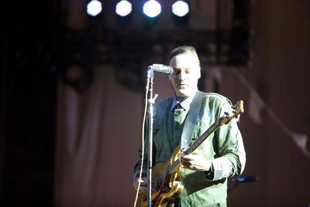 Win Butler rocks the stage with his guitar
