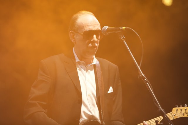 Mick Jones Rocks Coachella Stage with Guitar and Suit