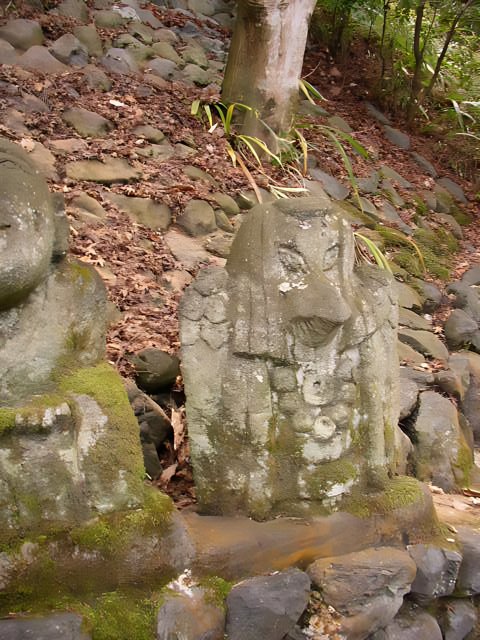 Stone Statues near a Tree