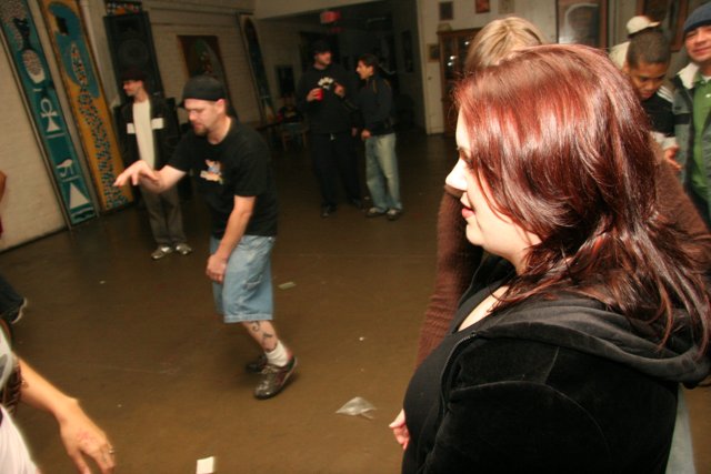 Red-haired woman takes center stage on the dance floor