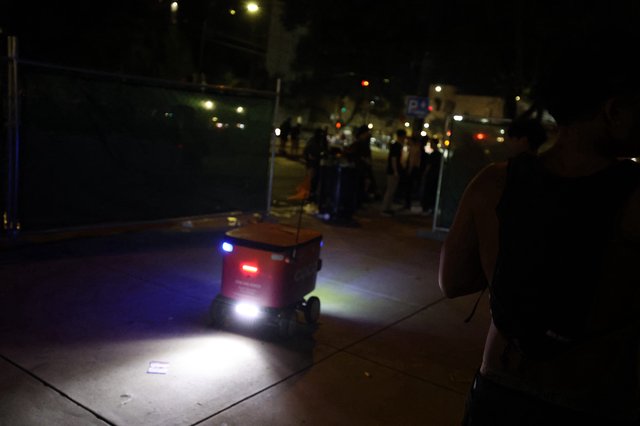 Autonomous Delivery Robot Navigates Nighttime Festival Crowd