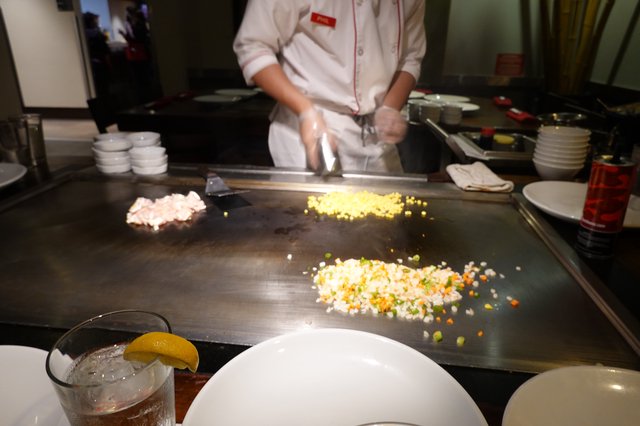 Teppanyaki Chef Cooking at Japanese Hibachi Grill