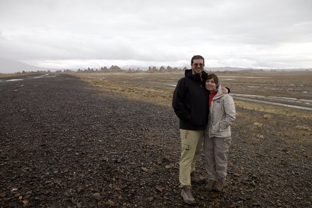 Couple Poses Among Trona Pinnacles Desert Landscape