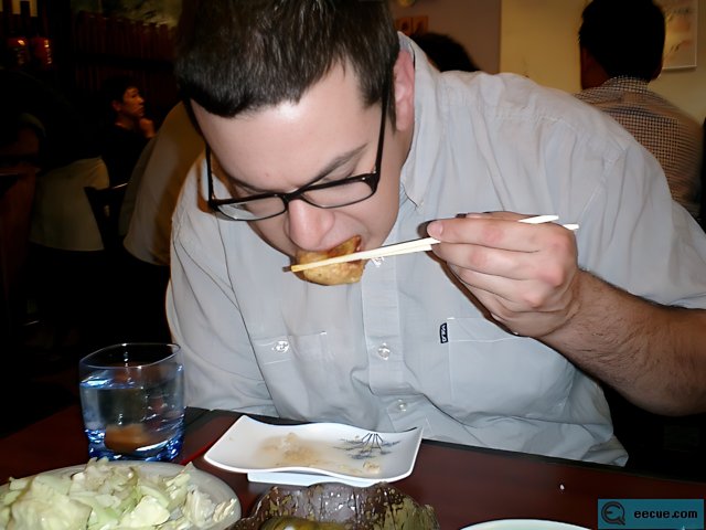 Man Eating at Restaurant