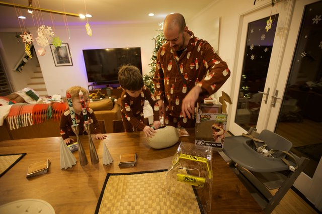 Father and Sons Building Christmas Dinosaur Models Together