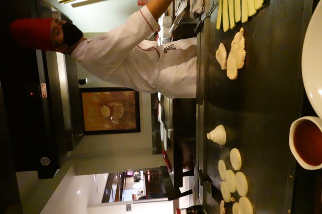 Teppanyaki Chef Cooking at Japanese Grill