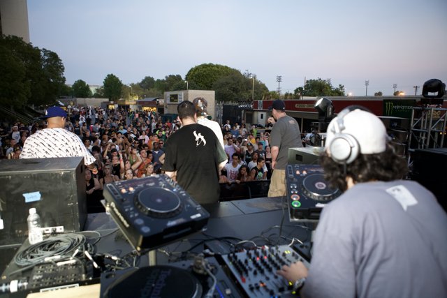 DJ Sven Kwiatkowski Plays to a Vibrant Crowd Against a Blue Sky