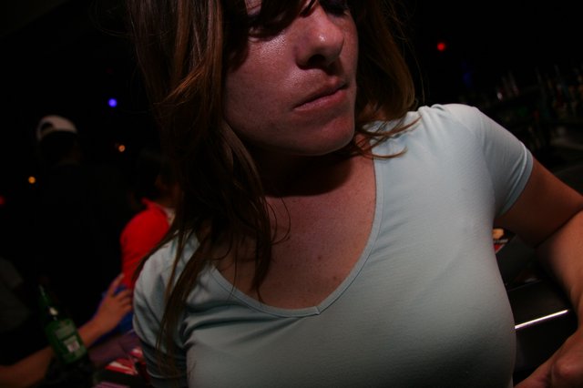 Woman at Nightclub in Dramatic Ambient Light