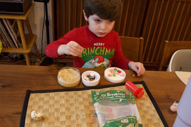 Child Playing with Elf Breakfast Play Dough Kit