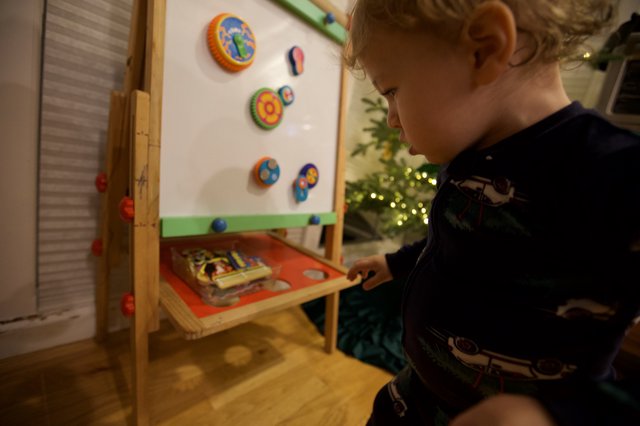 Young Child Playing with Educational Toy on Christmas