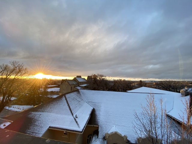 Sunset over Snowy Roof