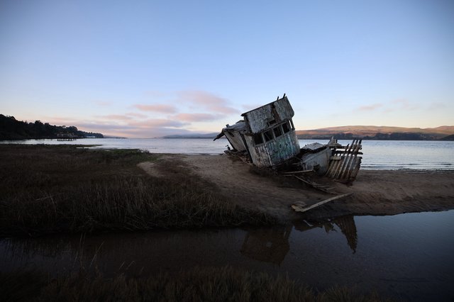 Abandoned Shipwreck at Twilight on California Coast