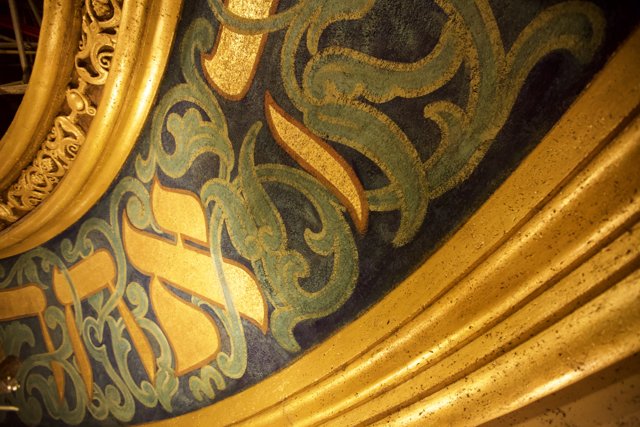 Ornate Gold and Blue Artwork Adorns Church Wall
