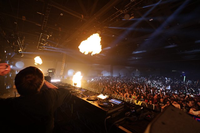 DJ Ignites the Crowd with Pyrotechnic Fury