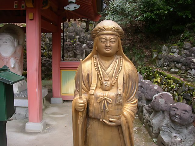Statue of Woman with Cup at Monastery Shrine