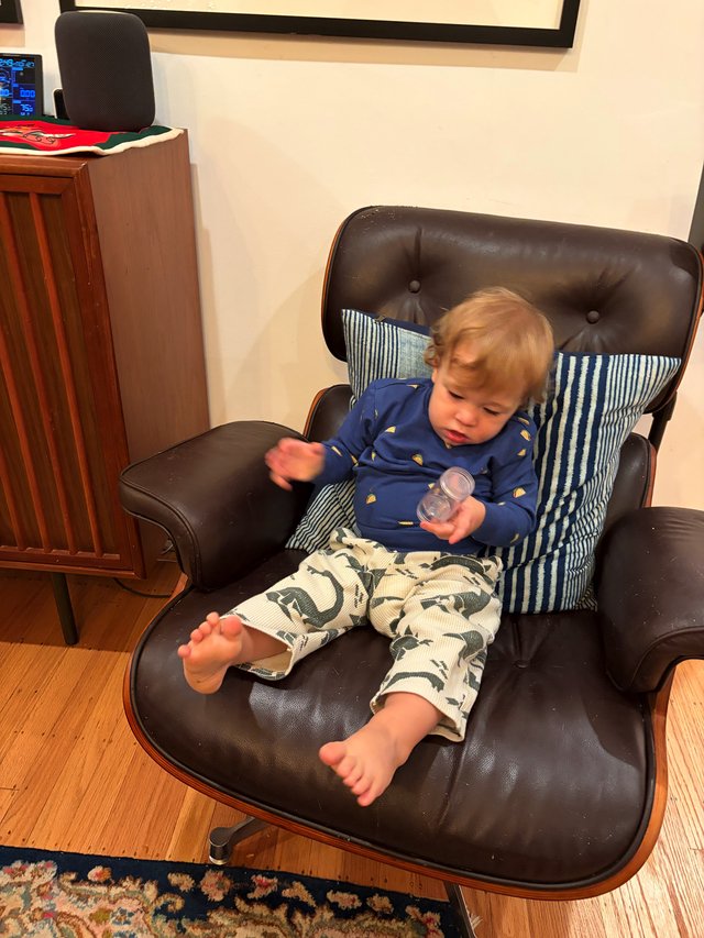 Toddler Relaxing in Mid-Century Modern Lounge Chair